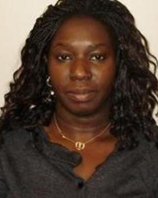 An image of Irene Ogolla from the neck up
